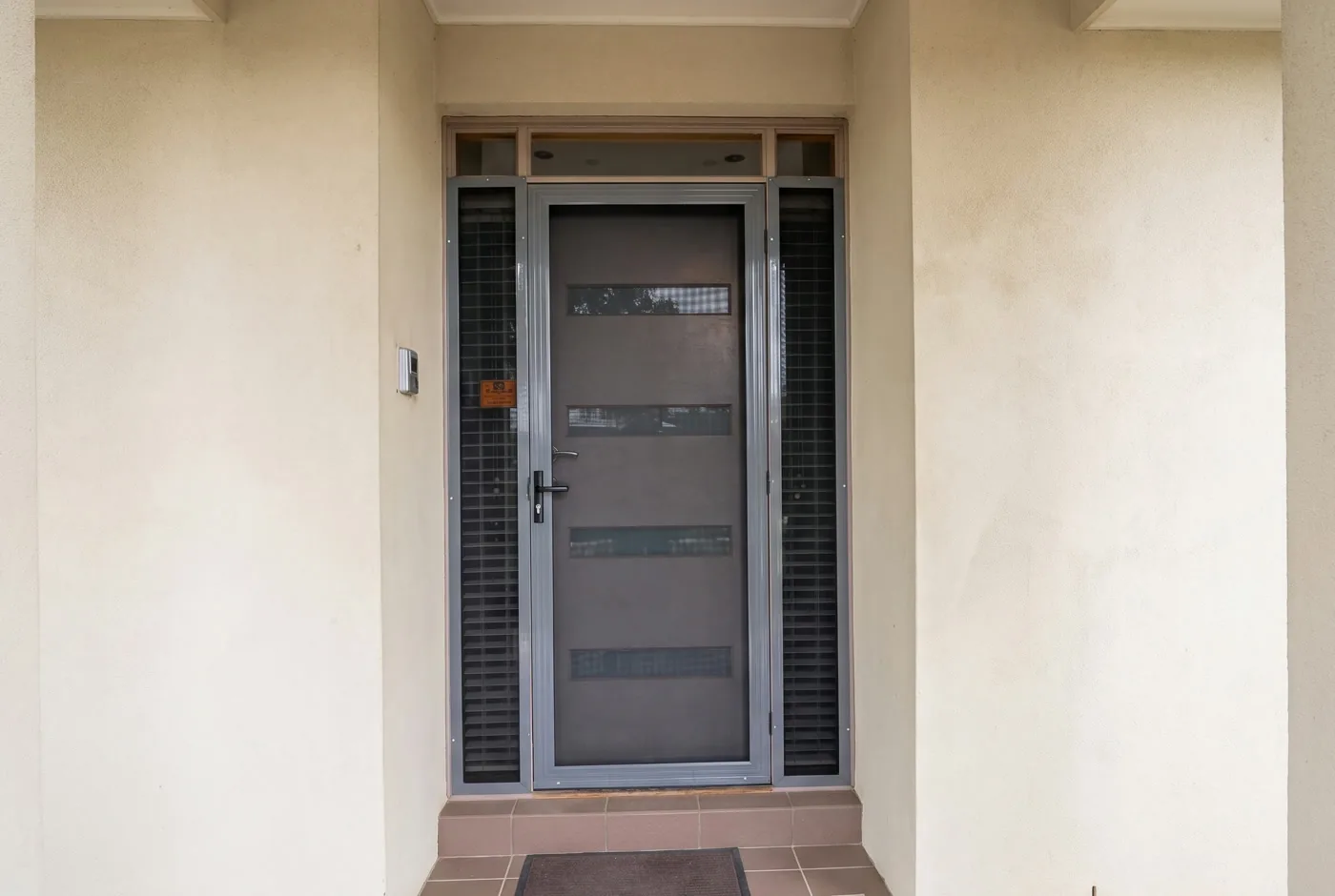 Modern security screen door with mesh feature windows and matching security side panels